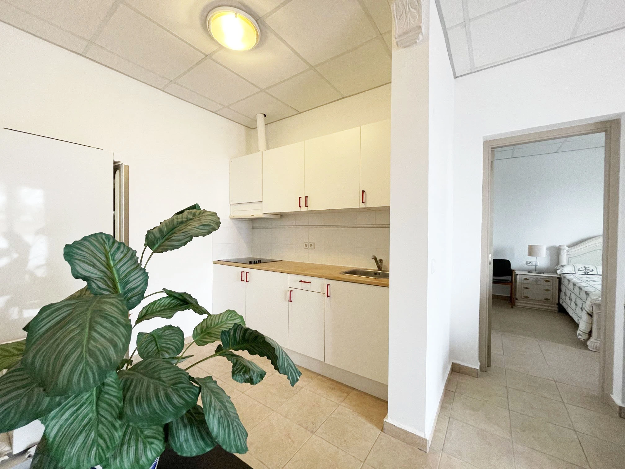 Kitchen and bedroom area inside detached villa in Calpe