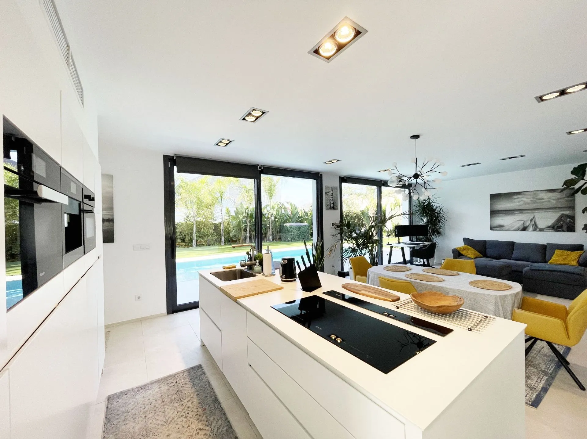 Kitchen with pool views at modern villa in Calpe