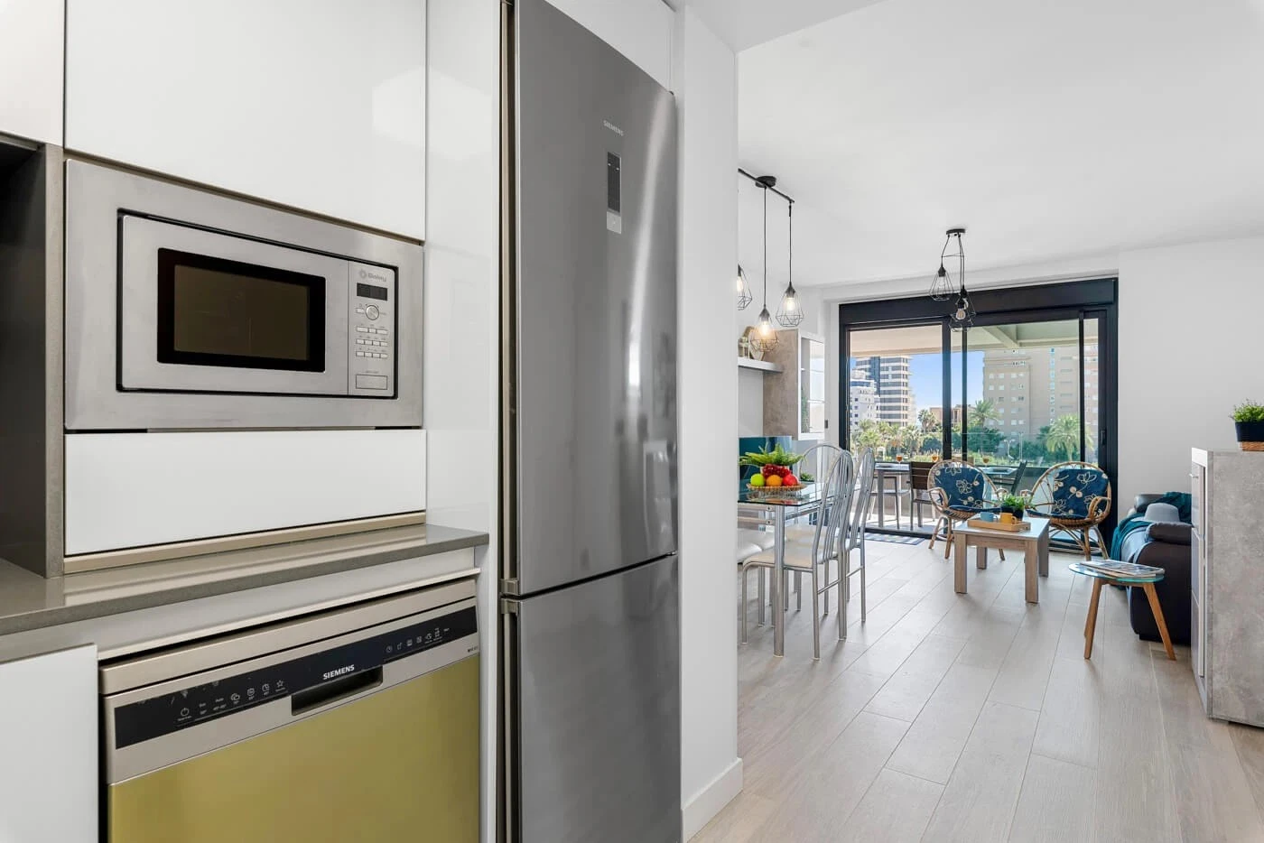 Kitchen with view through to the living room and terrace in apartment in Arenal-Bol, Calpe