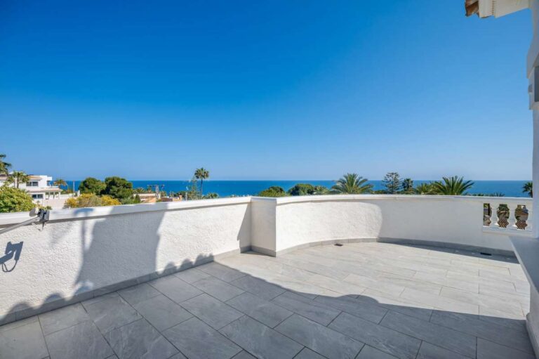 Large private terrace with sea views and white balustrade at a villa in Calpe.