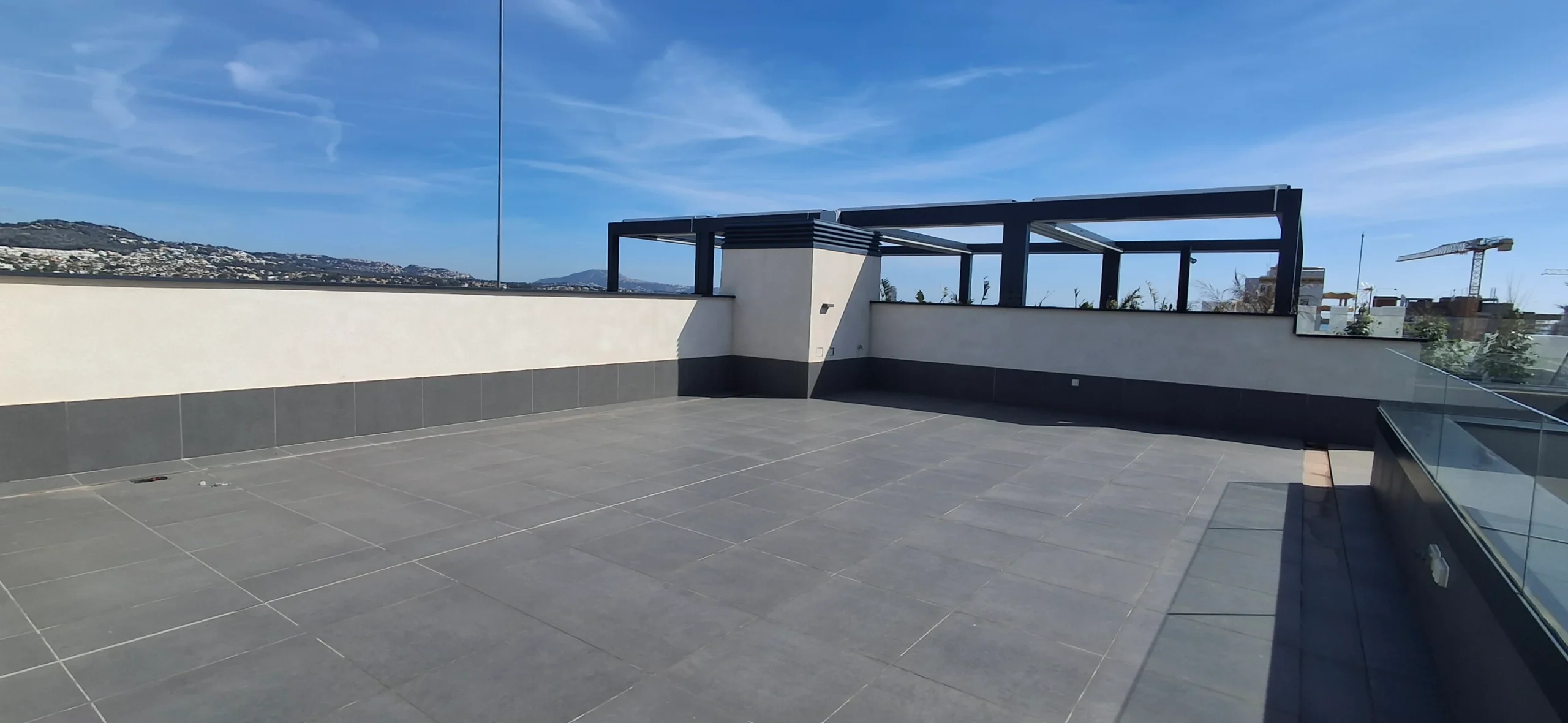 Large rooftop terrace with mountain views at modern penthouse in Calpe