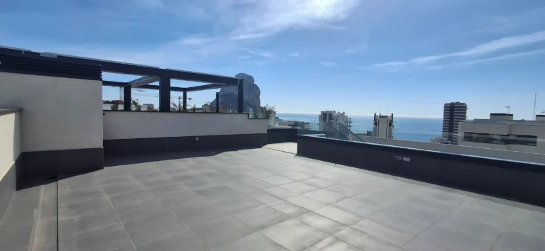 Large rooftop terrace with sea and mountain views at penthouse in Calpe`