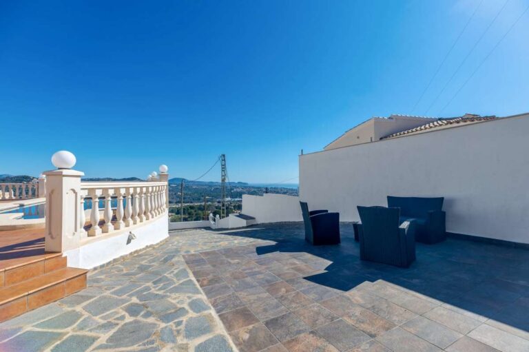 Large terrace with outdoor seating and open sea views at a villa in Calpe.