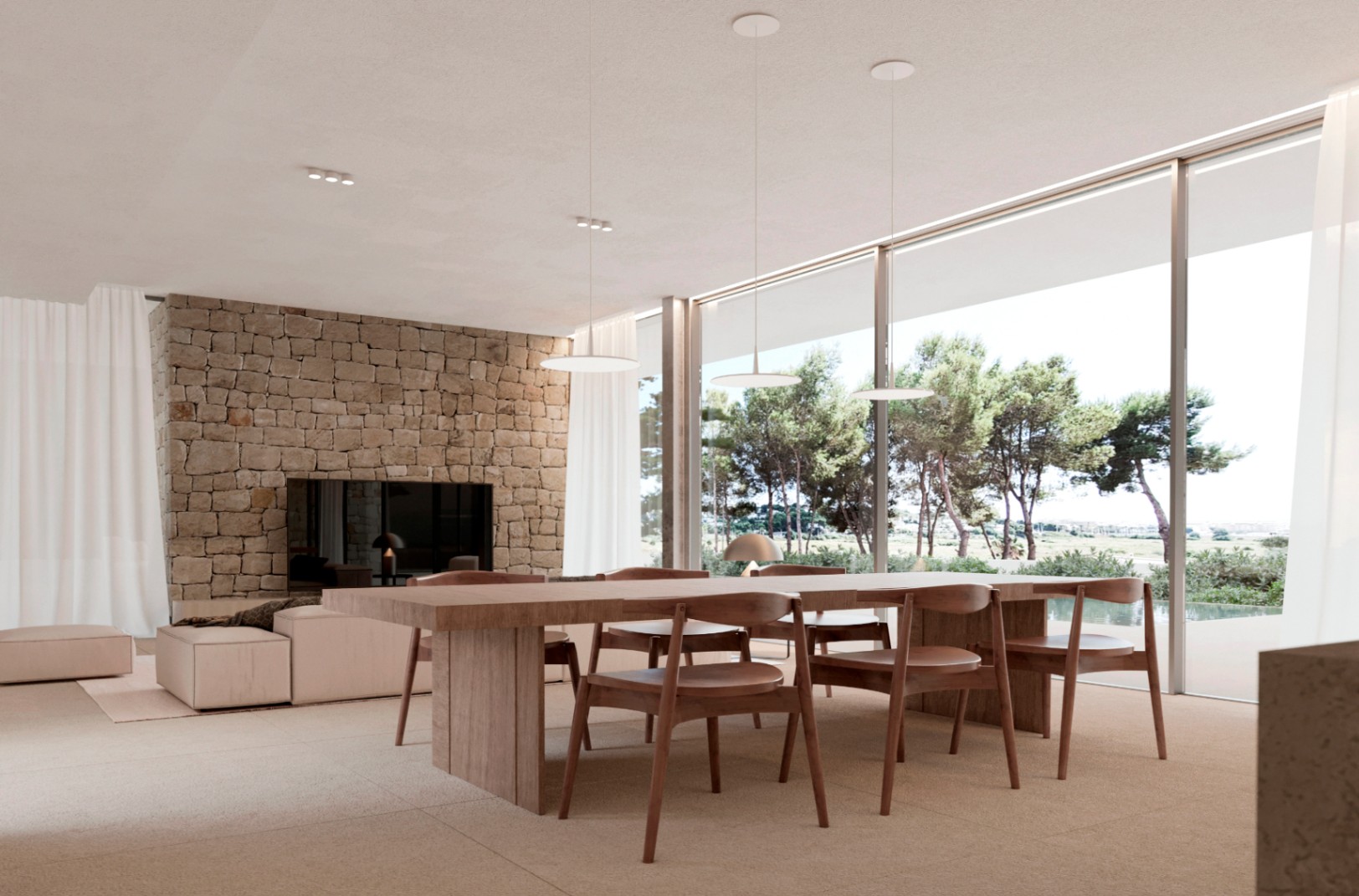 Living and dining area with large glass doors at new build villa in Moraira