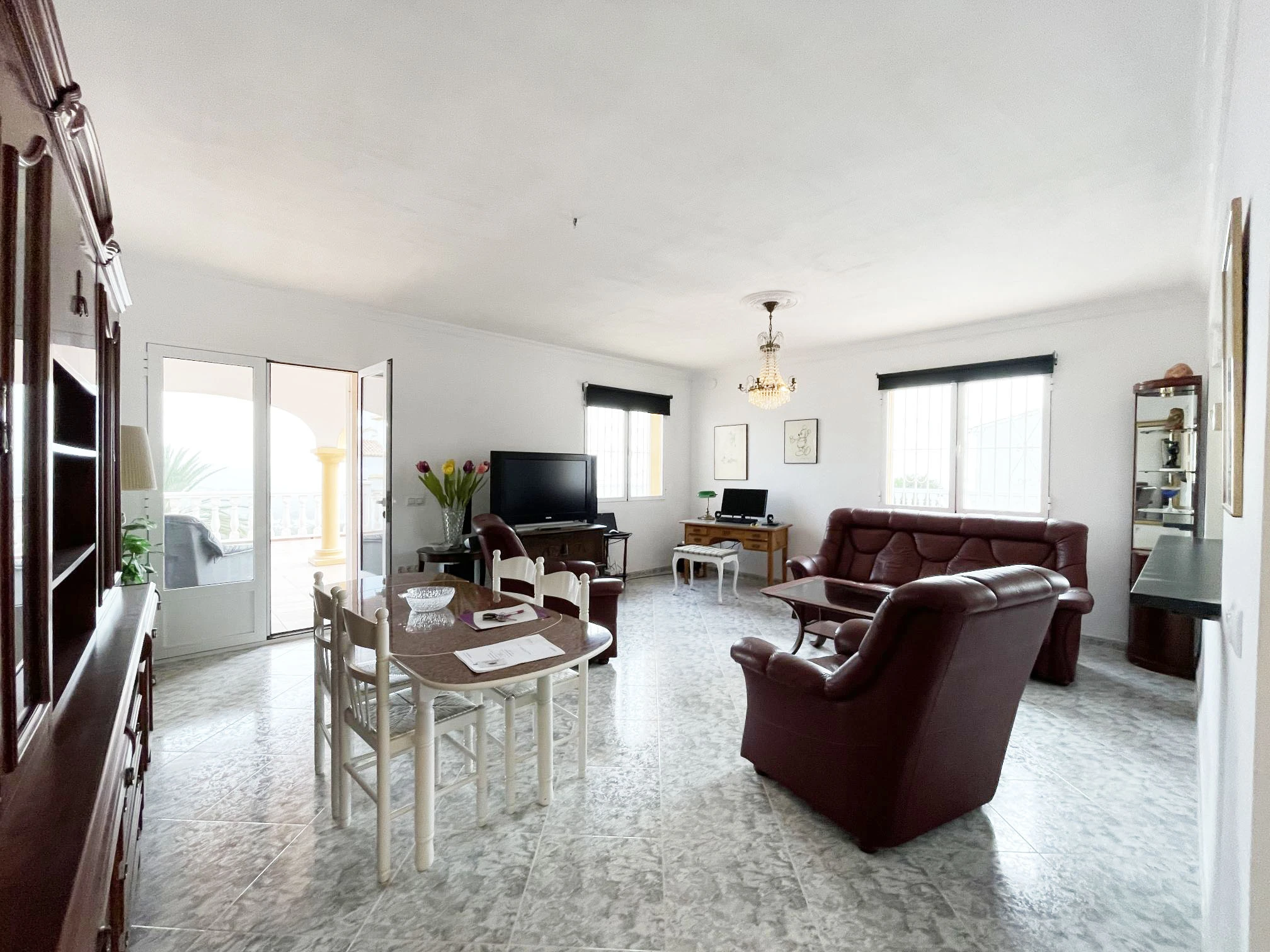 Living and dining room with terrace access at detached villa in Calpe