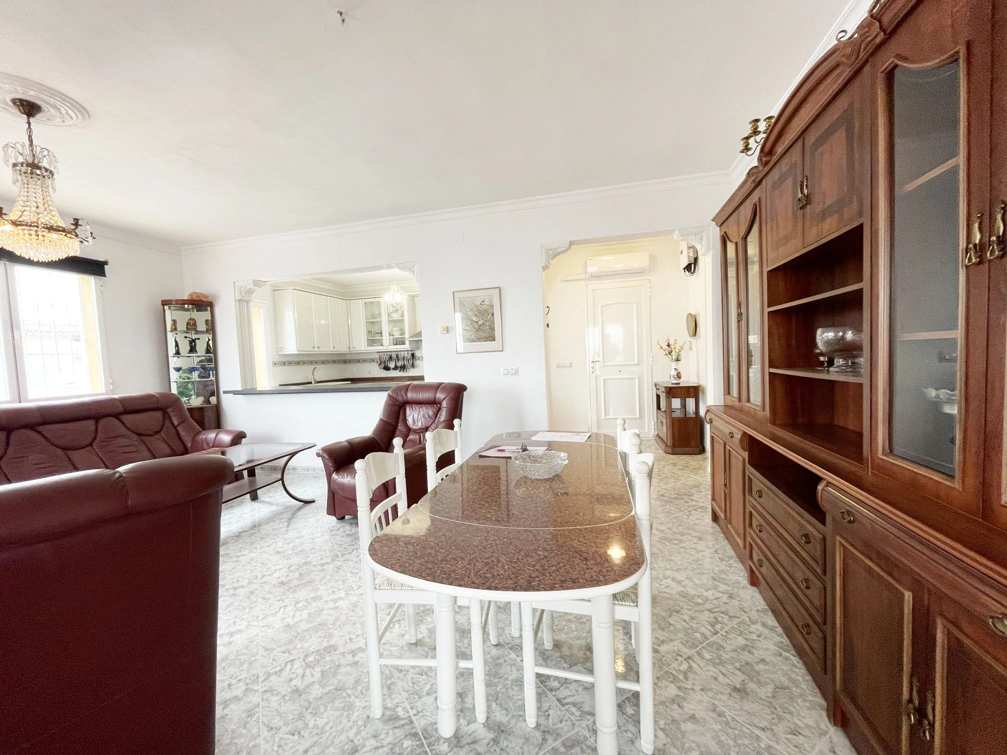 Living and dining room with open kitchen at detached villa in Calpe