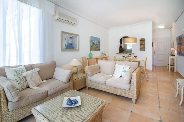 Living room and dining area inside bungalow in La Vallesa Calpe