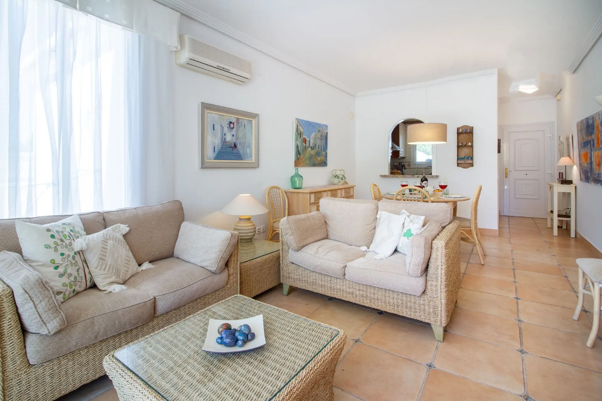 Living room and dining area inside bungalow in La Vallesa Calpe