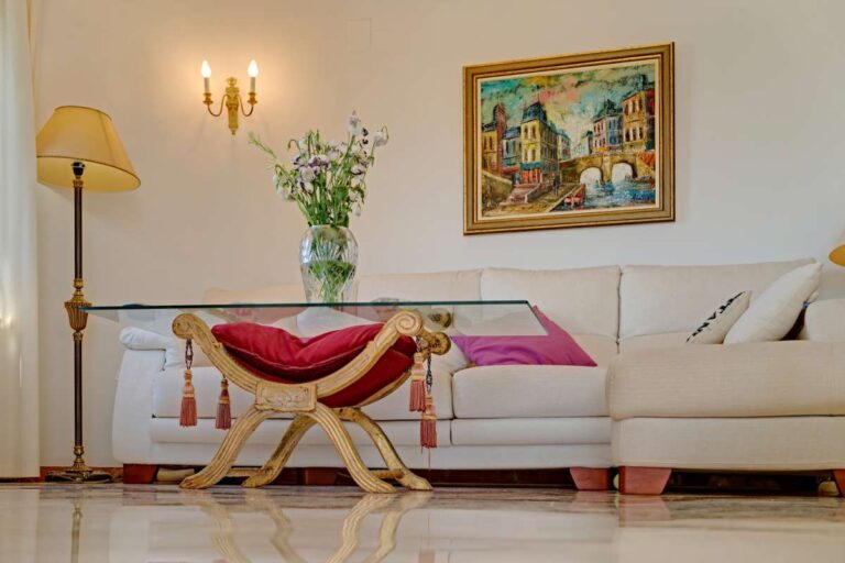 Living room detail with traditional furniture and artwork inside a Mediterranean villa near Puerto Blanco in Calpe.