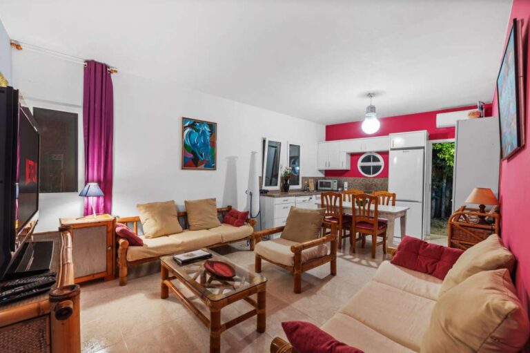 Living room inside an independent apartment of a Benissa sea view villa with seating area, dining space and open kitchen