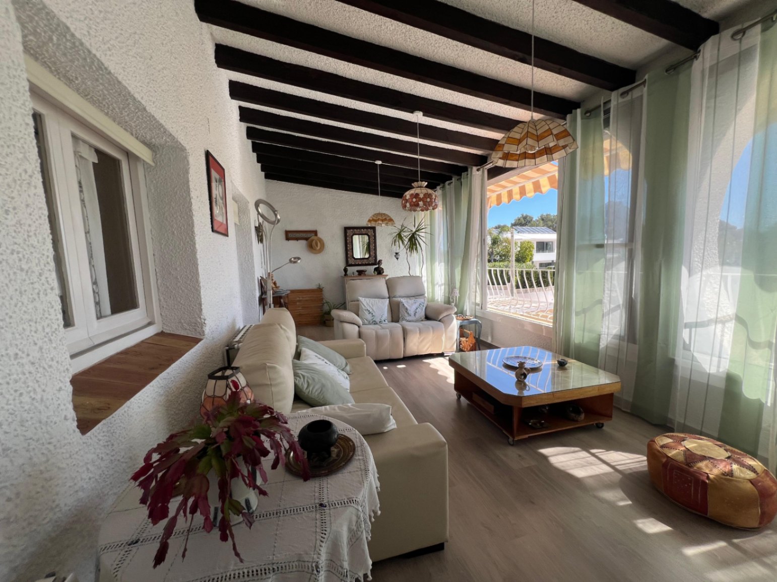 Living room with covered terrace access at villa in Buena Vista Benissa