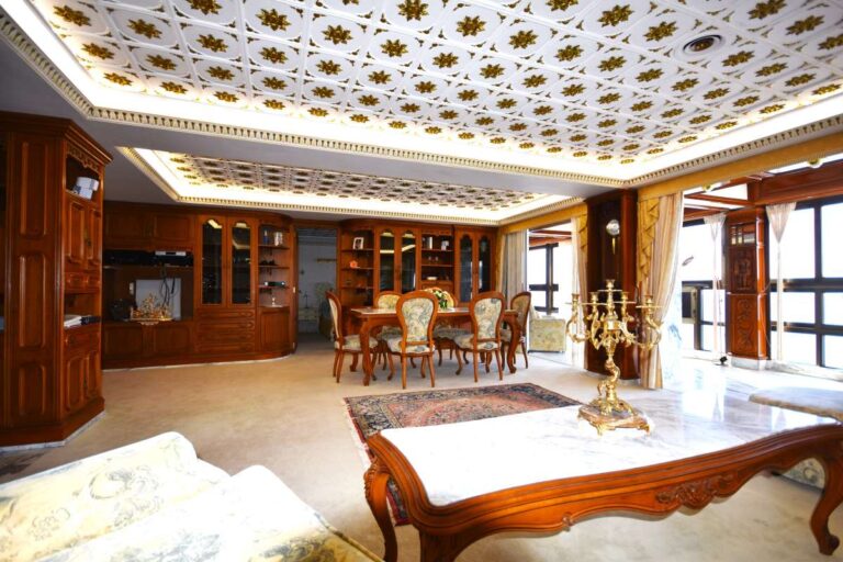 Living room with custom-made furniture, dining area and quality finishes inside a frontline double penthouse in Calpe.