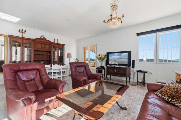 Living room with large windows and natural light inside a sea view villa in Calpe.