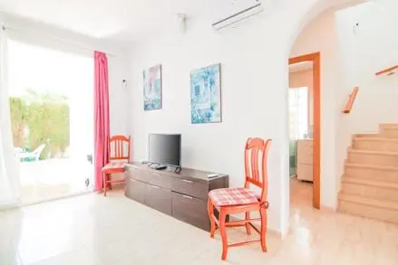 Living room with staircase and terrace access in bungalow in Cometa III, Calpe