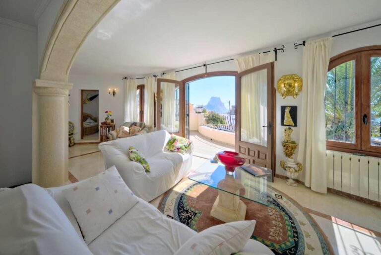 Living room with terrace access and natural light inside a second line Mediterranean villa in Calpe.