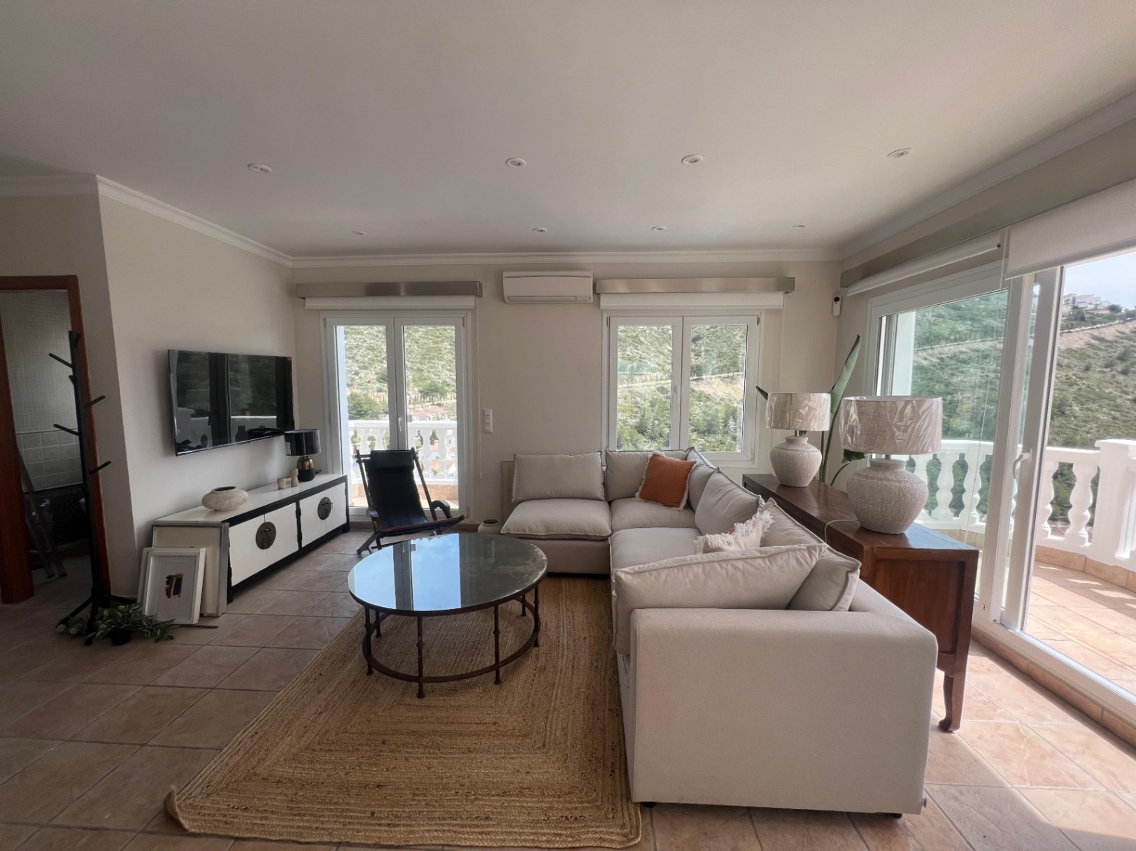 Living room with terrace access at modern three-level villa in Moraira