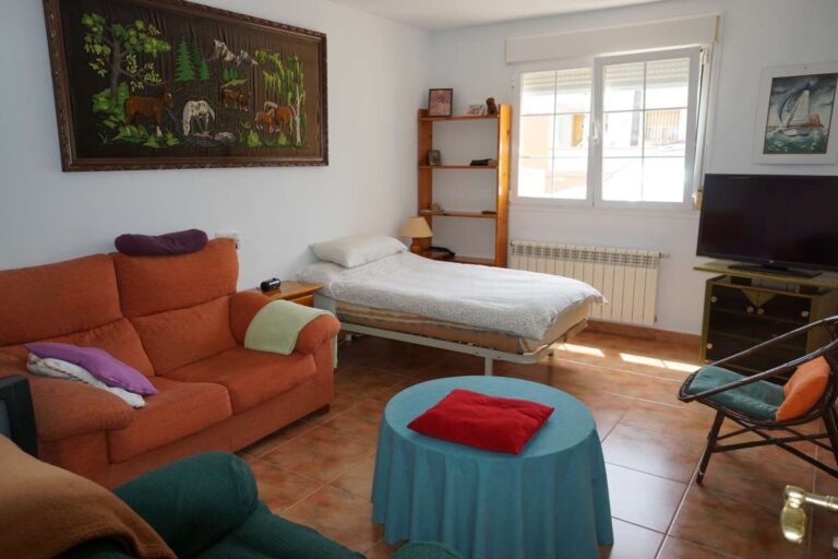 Living room with traditional furniture and natural light inside a Mediterranean villa in Calpe near La Calalga Beach.