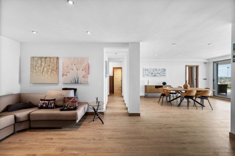 Lower level living and dining space with open layout inside a modern spacious villa for sale in Calpe.