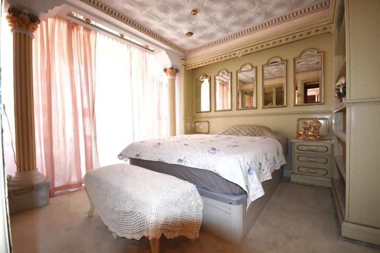 Main bedroom with custom-made furniture and quality finishes inside a frontline double penthouse on Arenal Beach in Calpe.