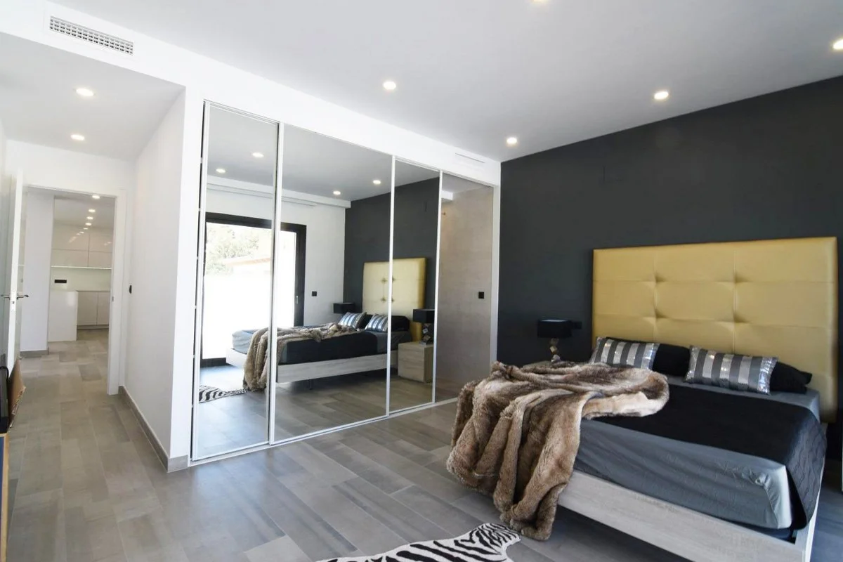 Main bedroom with fitted wardrobes in modern villa in Carrió, Calpe