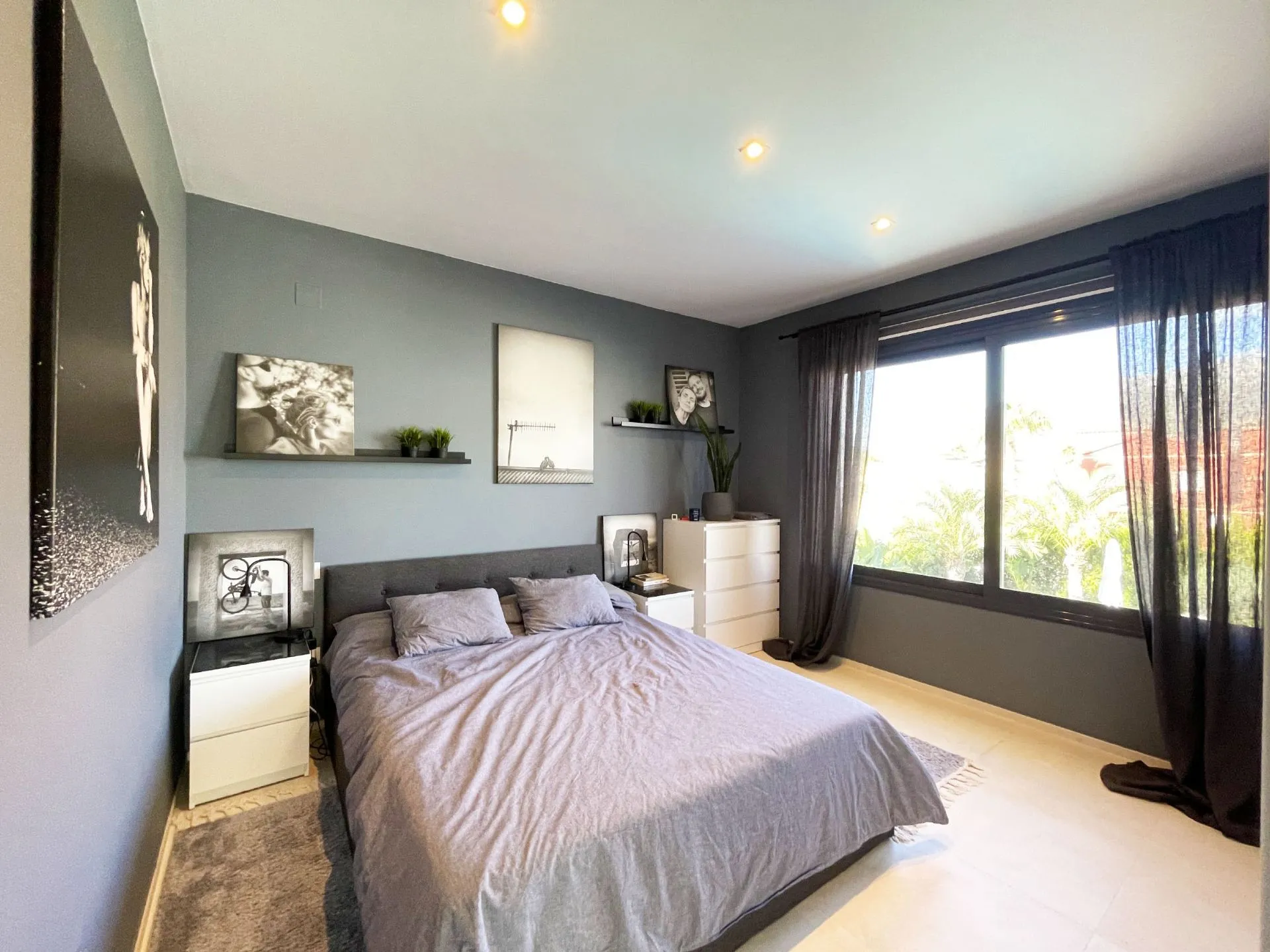 Main bedroom with large window at modern villa in Calpe