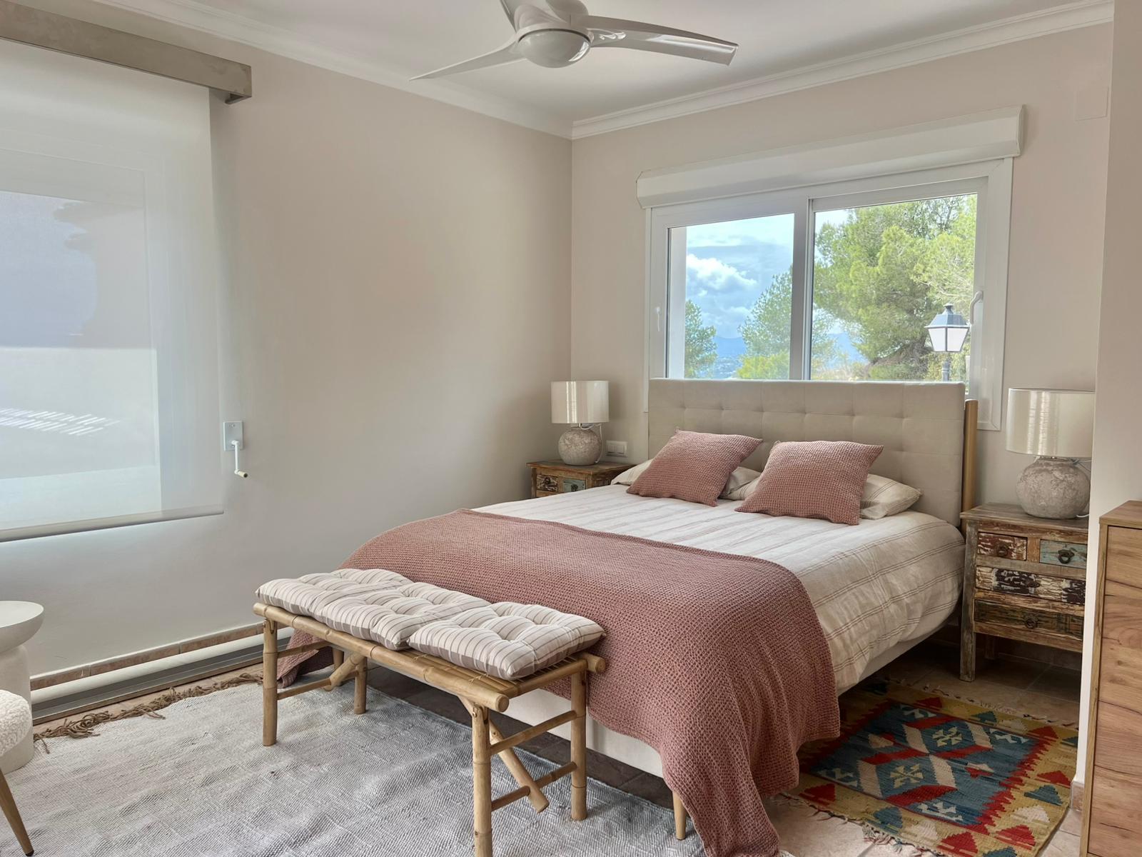 Master bedroom with private terrace at modern villa in Moraira