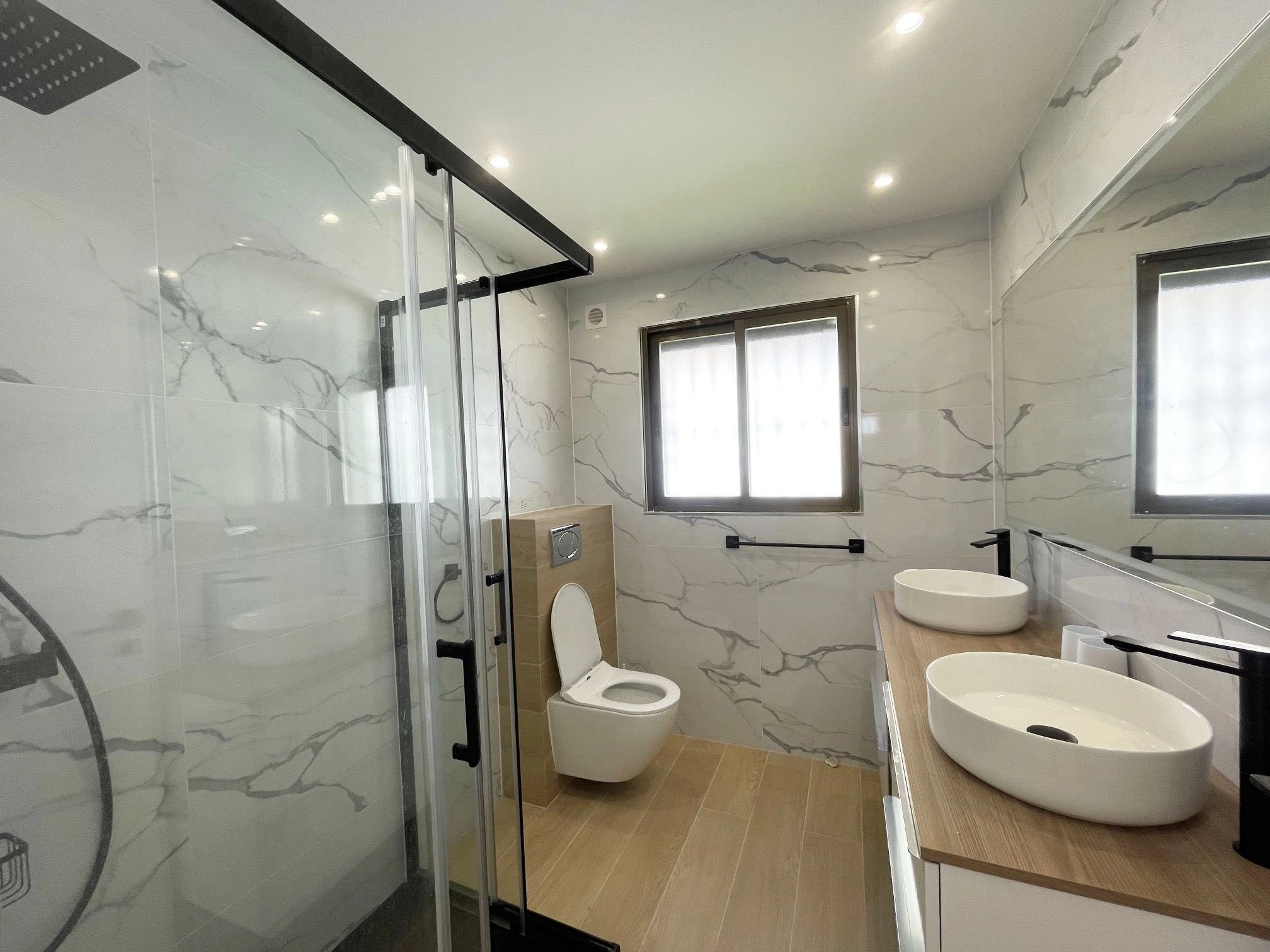 Modern bathroom with double sink at Oltamar villa in Calpe