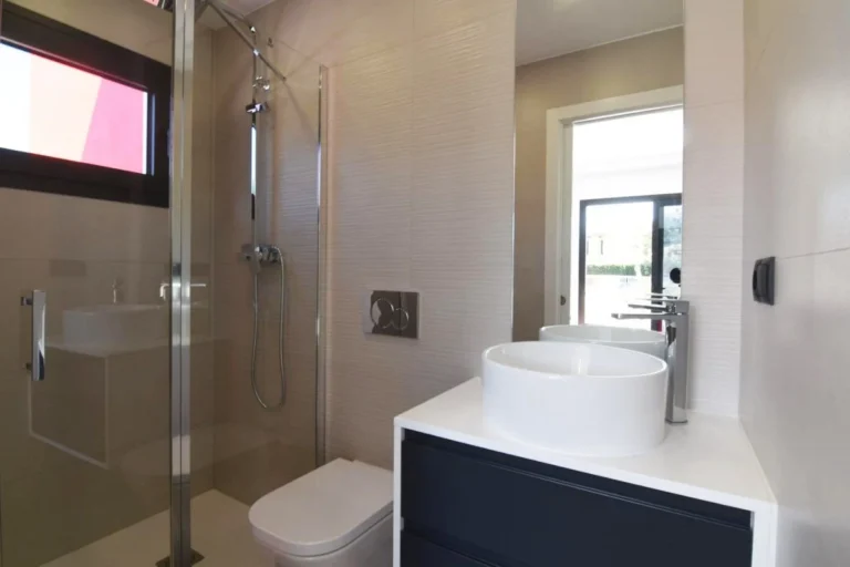 Modern bathroom with glass shower and vanity in villa in Calpe
