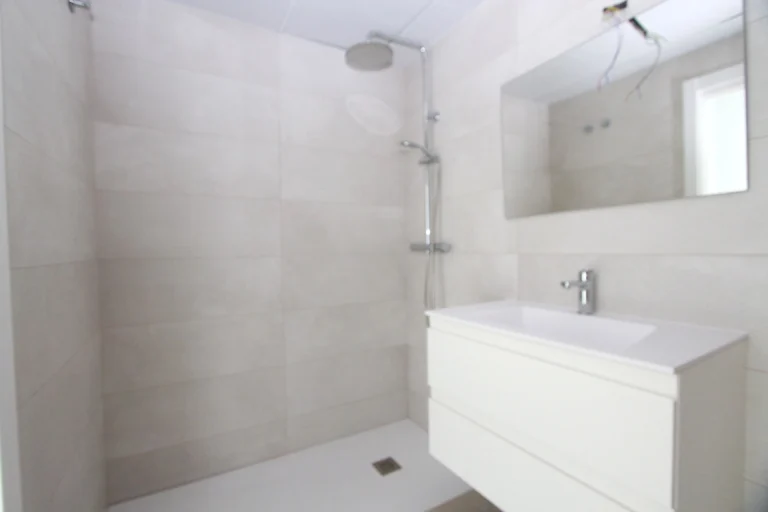 Modern bathroom with walk-in shower inside luxury penthouse in Calpe