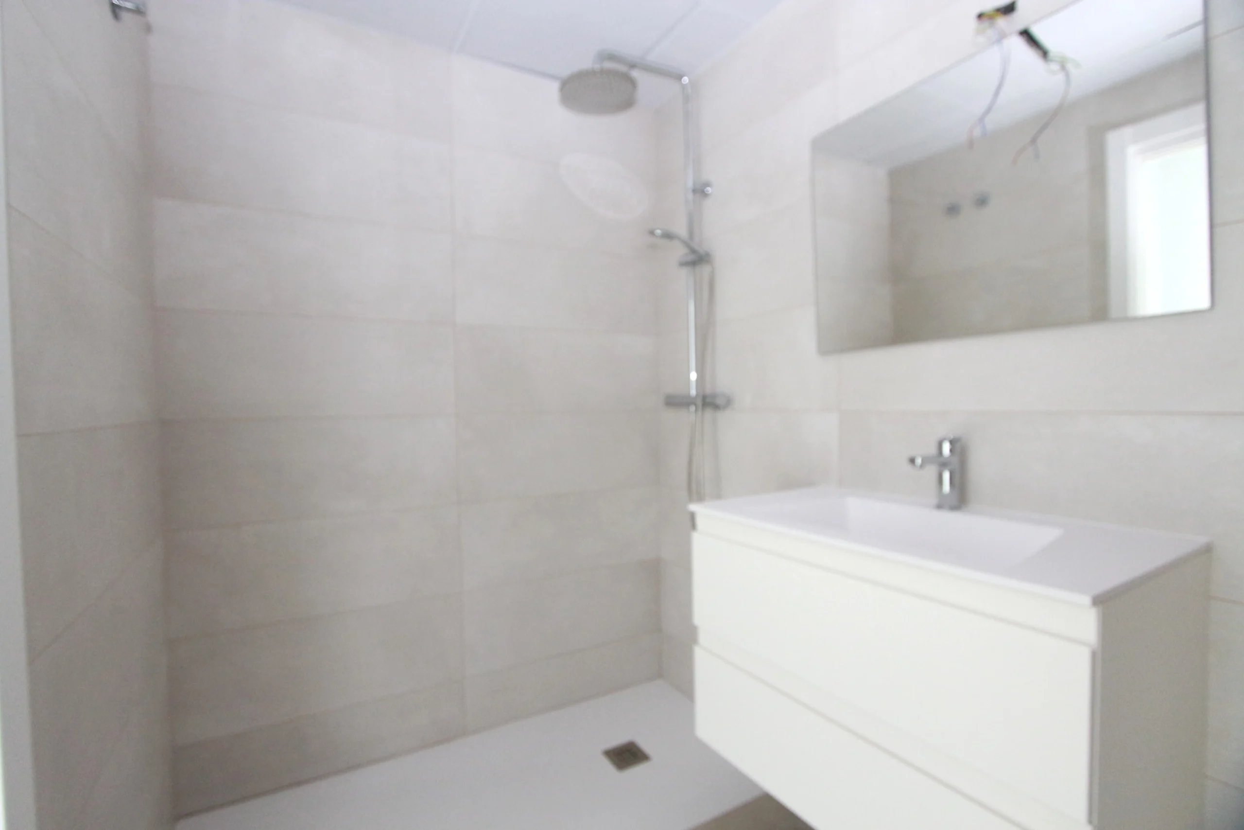 Modern bathroom with walk-in shower inside luxury penthouse in Calpe