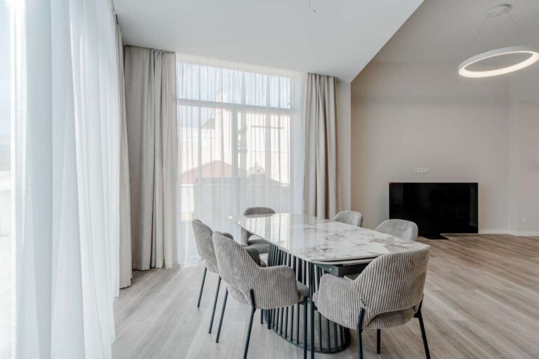 Modern dining room with large windows inside a new build three bedroom villa in Calpe