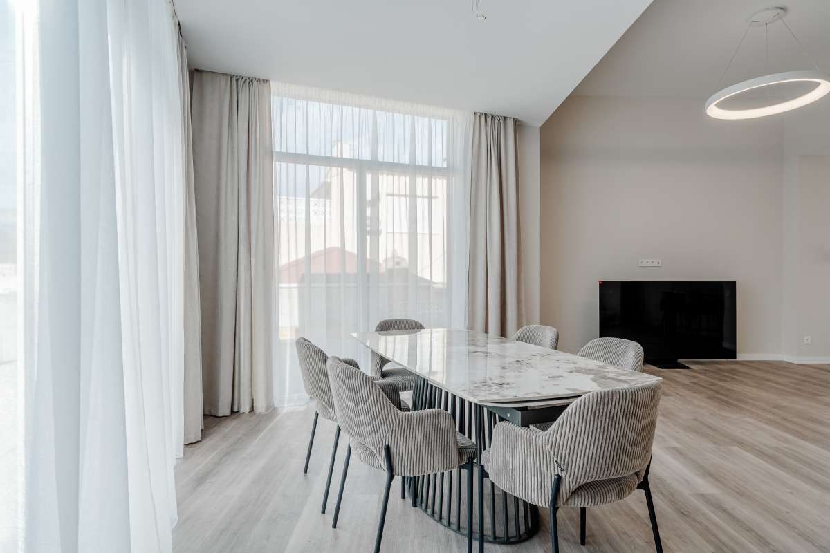 Modern dining room with large windows inside a new build three bedroom villa in Calpe
