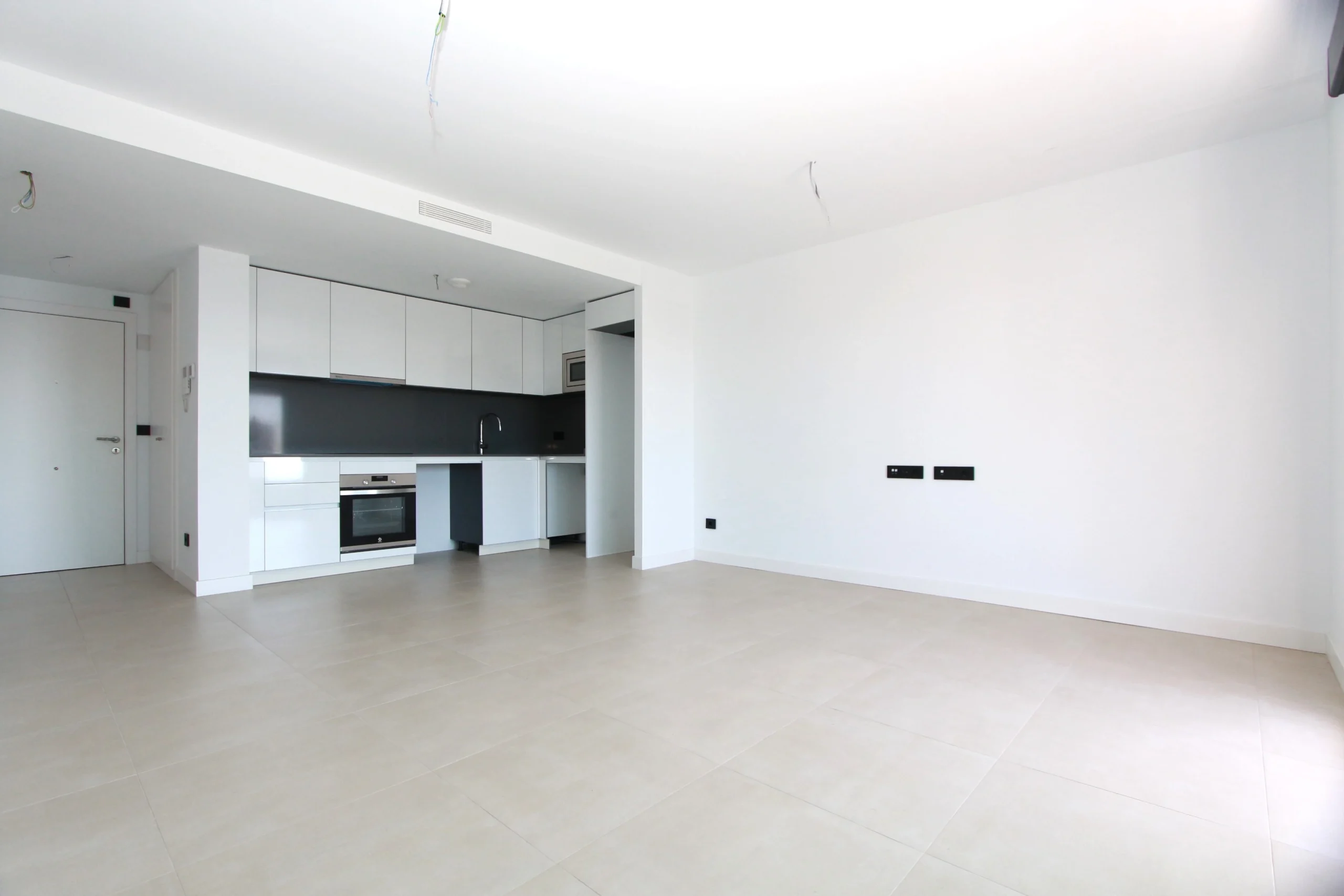 Modern open living space with kitchen at luxury penthouse in Calpe`