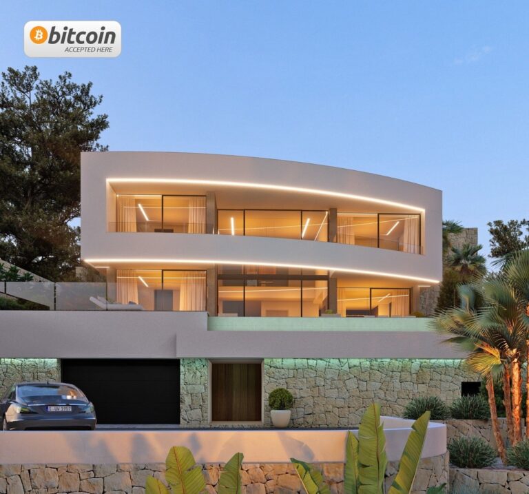 Modern sea view villa in Calpe with illuminated exterior and pool
