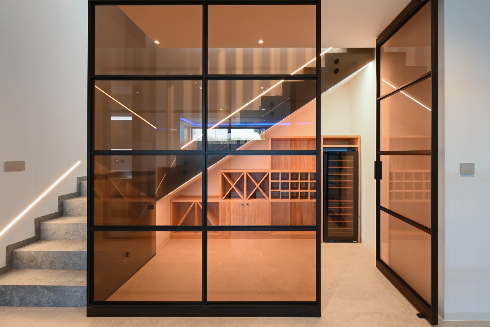 Modern staircase and glass hallway at luxury villa near La Fustera Beach