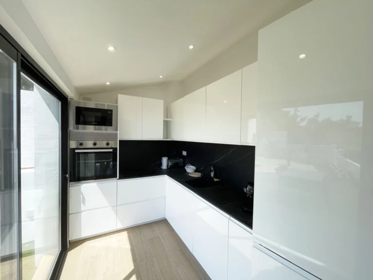 Modern white kitchen at villa in renovation in Oltamar, Calpe