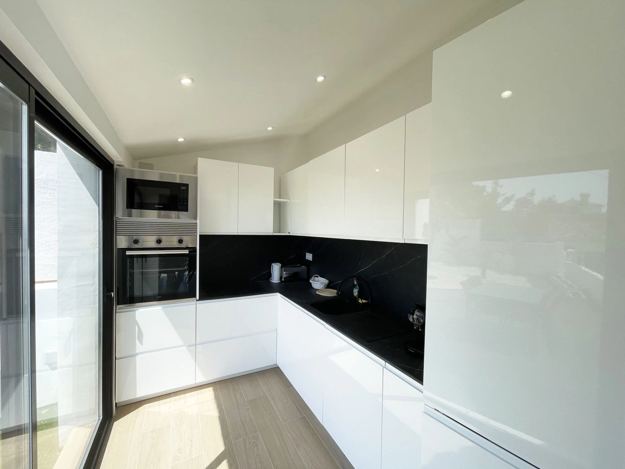 Modern white kitchen at villa in renovation in Oltamar, Calpe