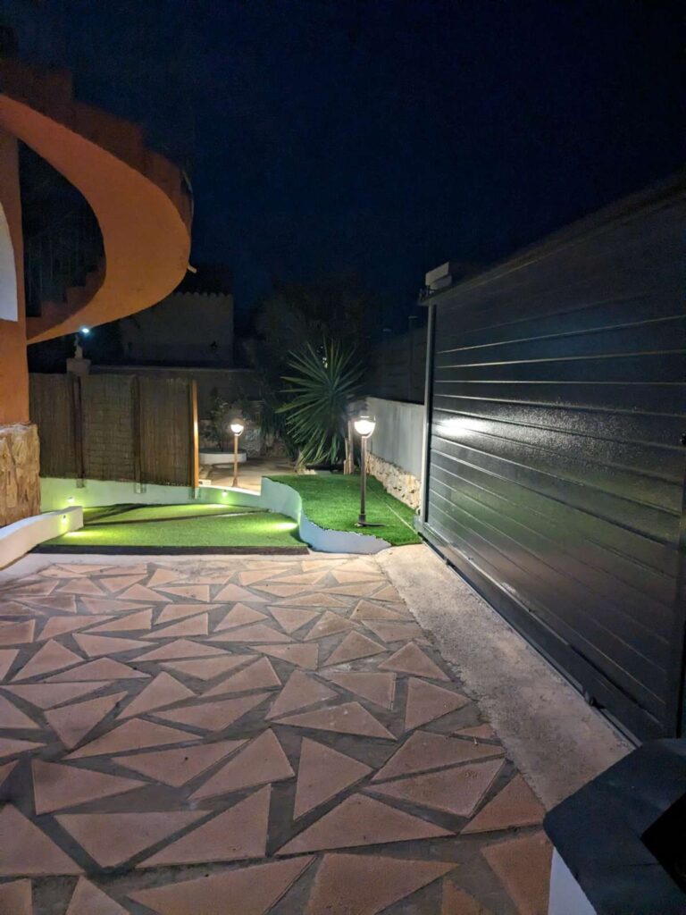 Night view of the terrace and garage area at a refurbished villa with three independent apartments in Canuta, Calpe.