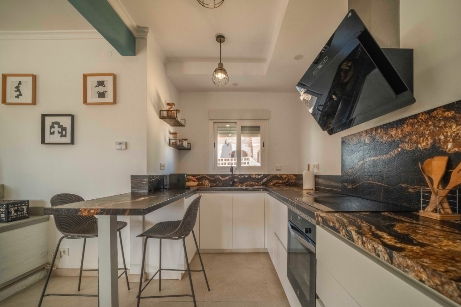 Open kitchen and breakfast bar at renovated villa in Calpe