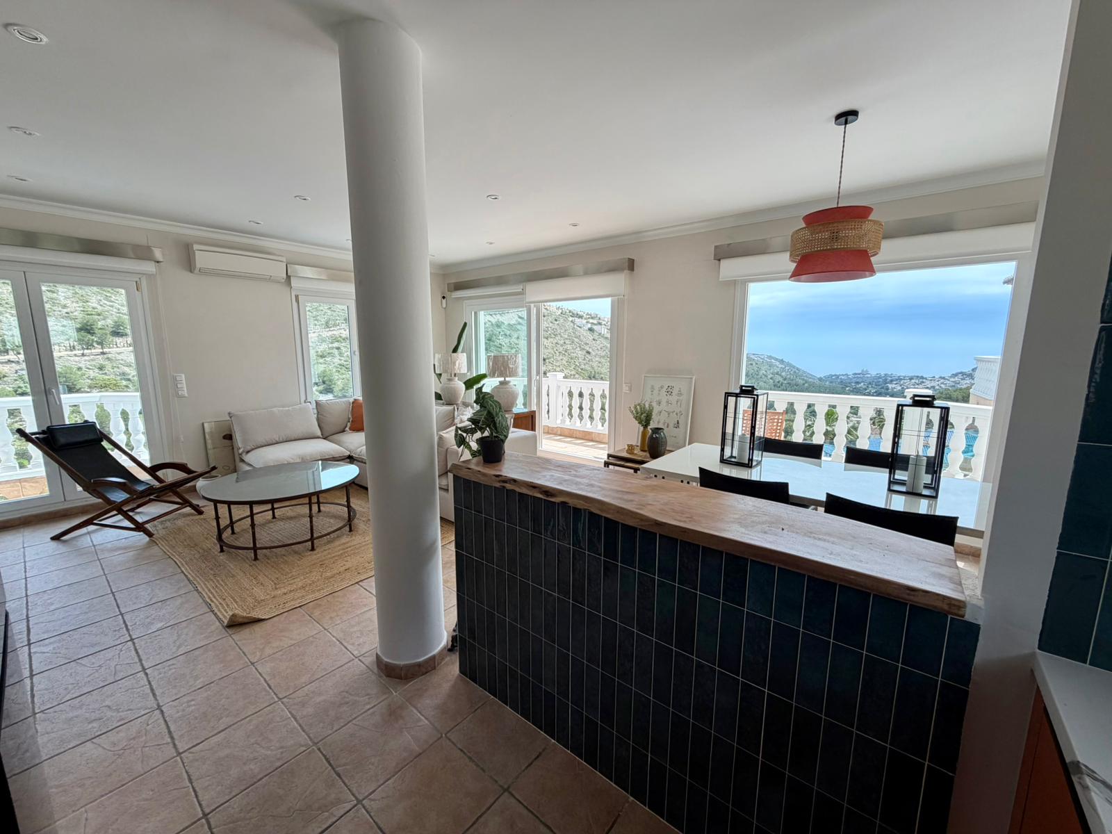 Open kitchen and living area at modern three-level villa in Moraira