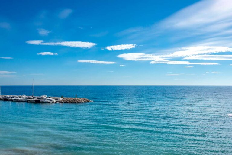 Open Mediterranean Sea views from a luxury frontline beach duplex in Mascarat, Altea with marina views, coastline and clear blue water