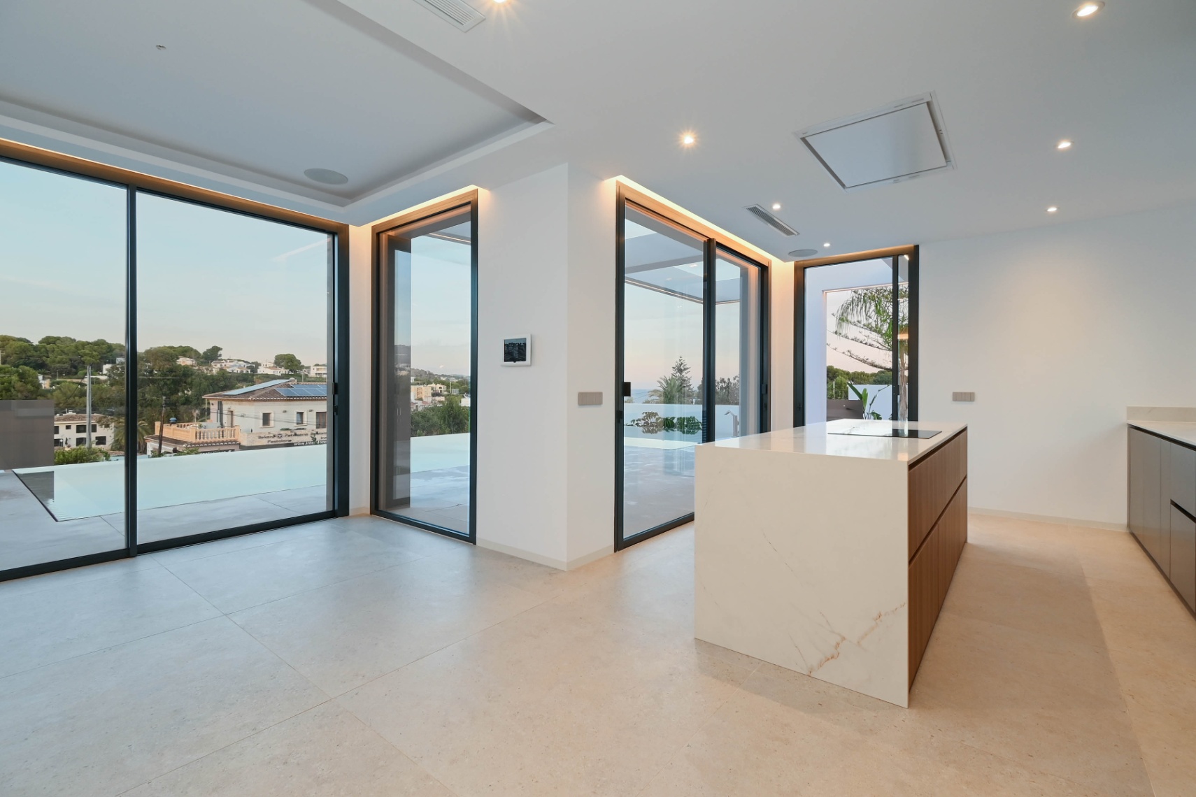 Open-plan kitchen and living area at luxury villa near La Fustera Beach