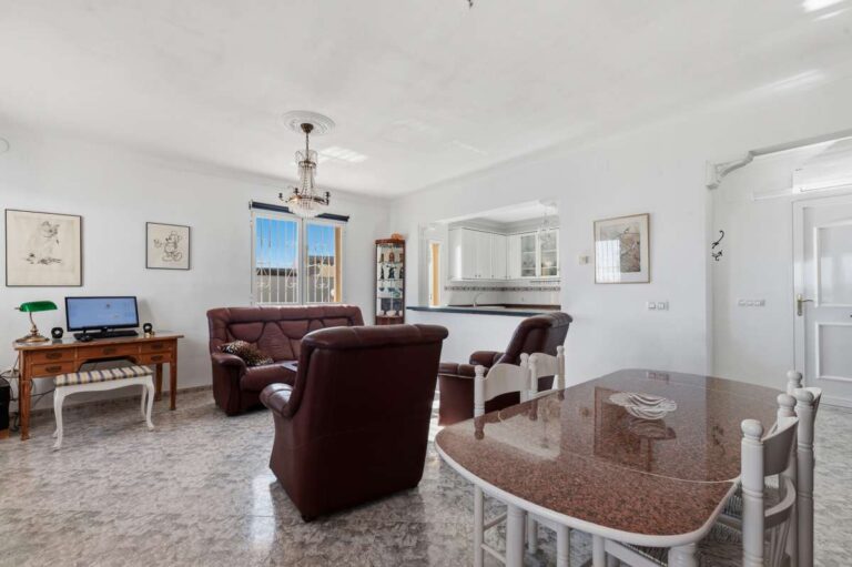 Open-plan kitchen and living room inside a villa in Calpe with bright interior space.