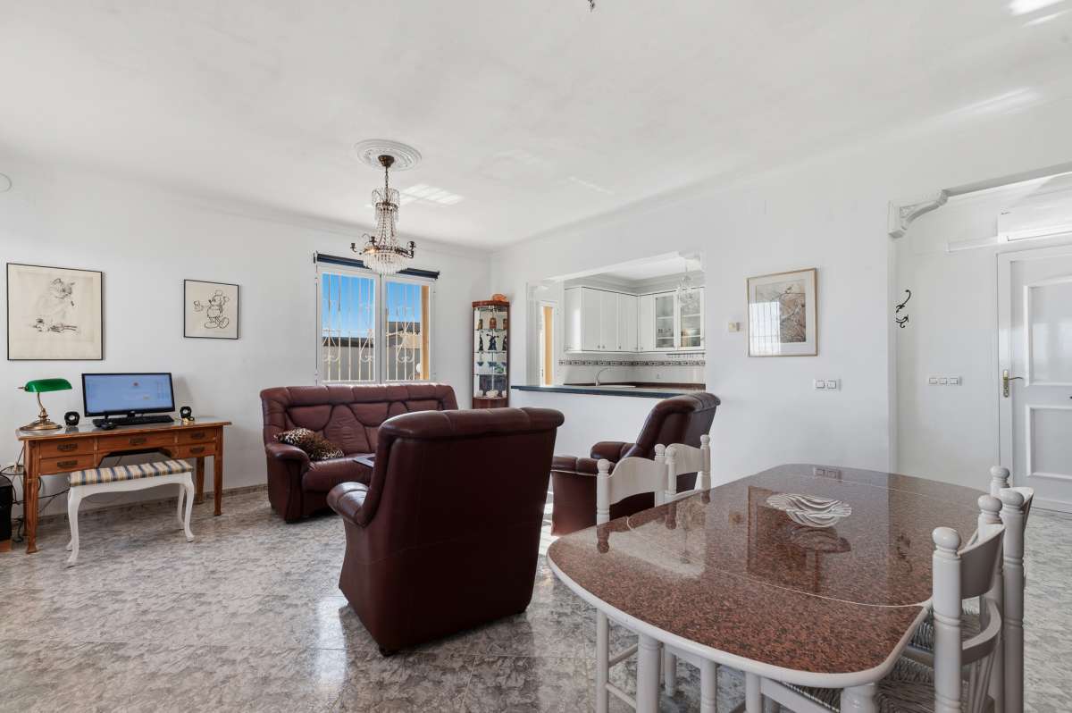 Open-plan kitchen and living room inside a villa in Calpe with bright interior space.