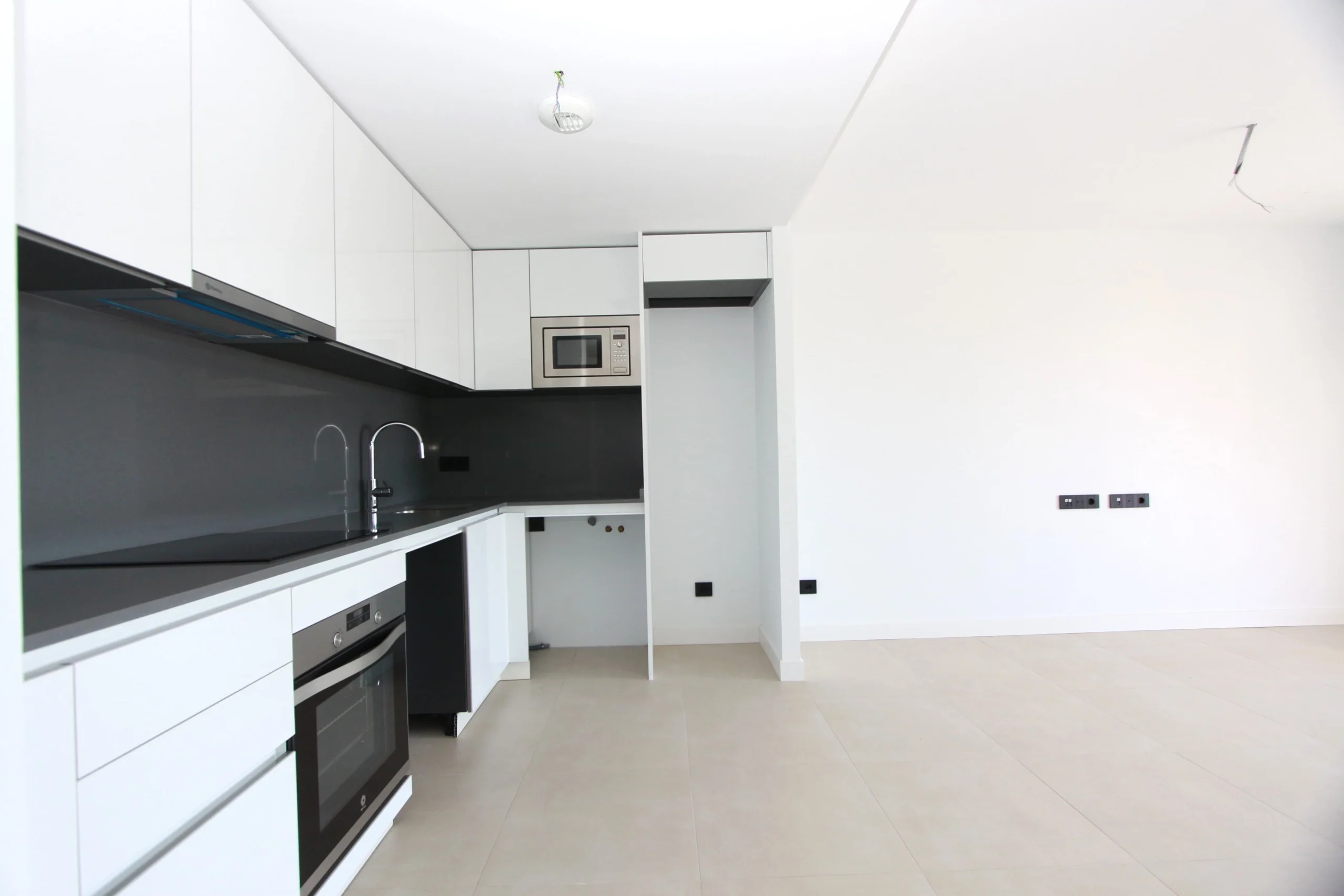 Open-plan kitchen and living space inside modern penthouse in Calpe