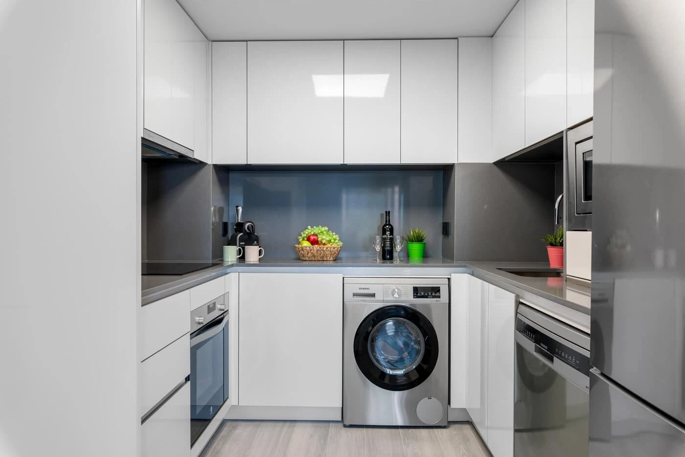 Open-plan kitchen with appliances in 3-bedroom apartment in Arenal-Bol, Calpe