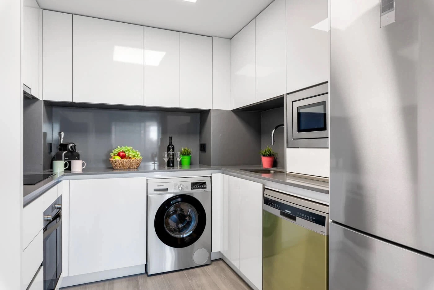Open-plan kitchen with appliances in apartment in Arenal-Bol, Calpe