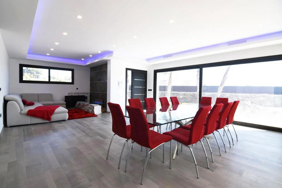 Open-plan living and dining area with terrace access in modern villa in Carrió, Calpe