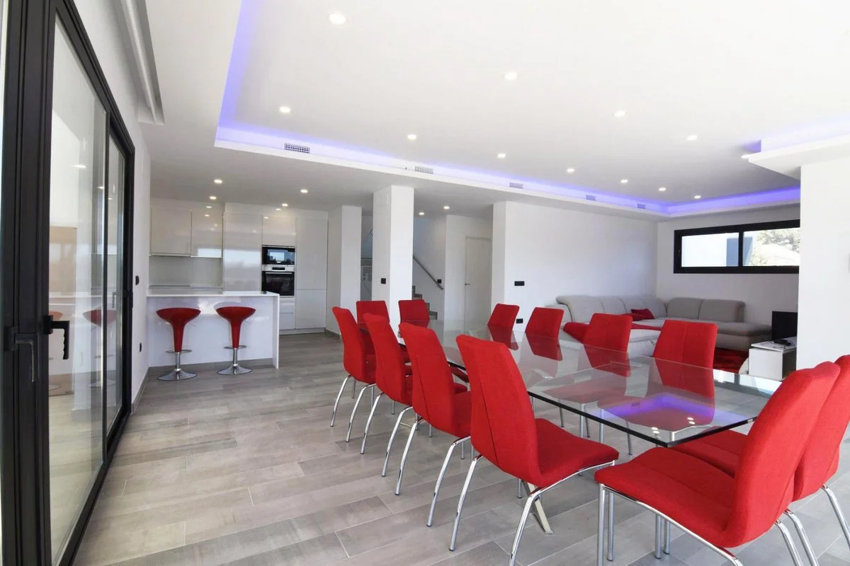 Open-plan living, dining, and kitchen area in modern villa in Carrió, Calpe