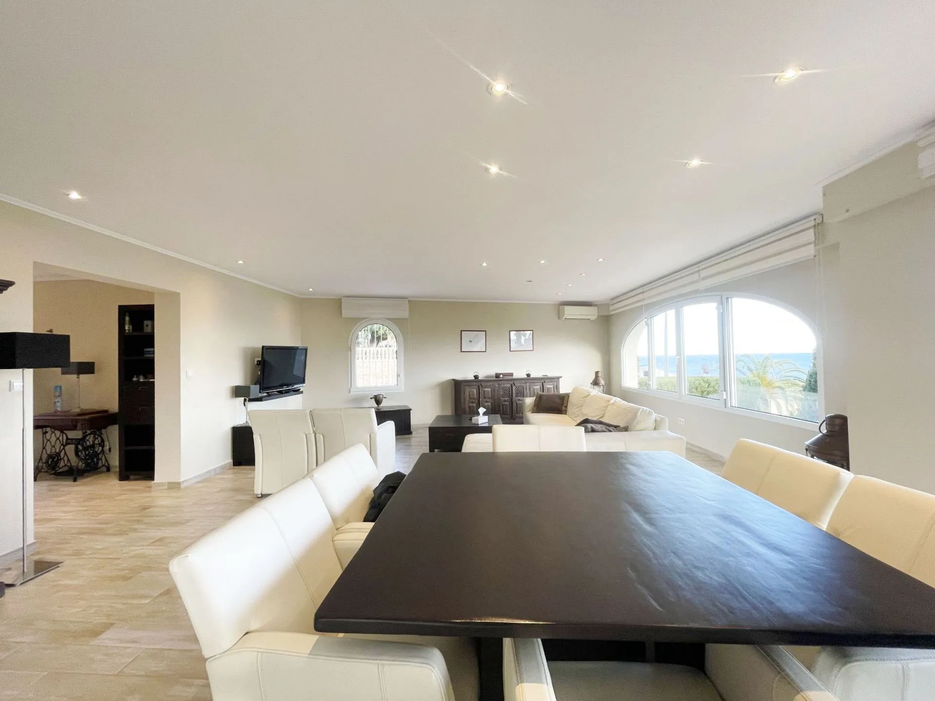 Open-plan lounge and dining area with sea views in renovated Calpe villa